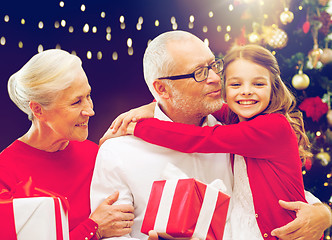 Image showing happy family with christmas gifts