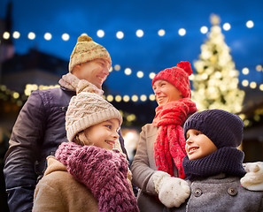 Image showing happy family outdoors at christmas eve