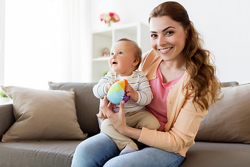 Image showing happy young mother with little baby at home