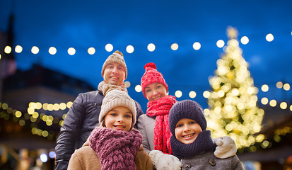 Image showing happy family outdoors at christmas eve