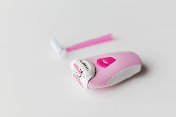 Image showing epilator and safety razor on white background