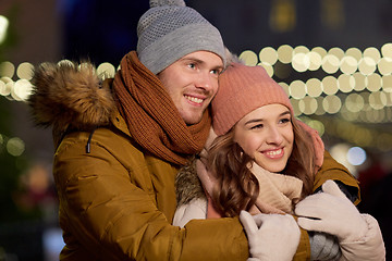 Image showing happy couple hugging at christmas tree