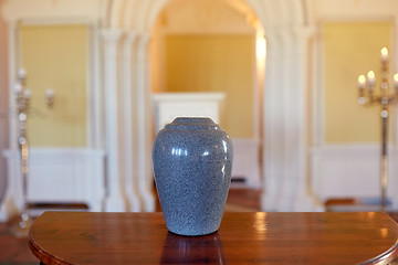 Image showing cremation urn on table in church