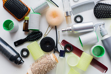 Image showing hair brushes, styling sprays, curlers and pins