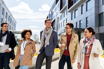 Image showing people with coffee and conference badges in city