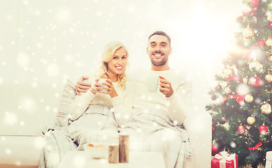 Image showing happy couple at home with christmas tree