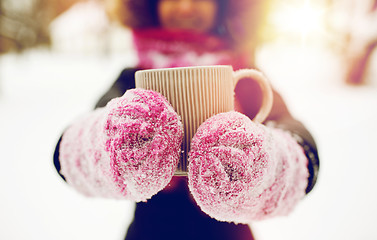 Image showing close up of woman with tea mug outdoors in winter