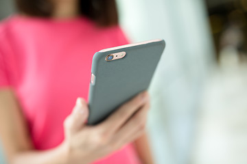 Image showing Woman holding a phone