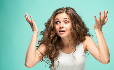 Image showing Portrait of young woman with shocked facial expression