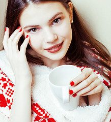 Image showing young pretty brunette girl in Christmas ornament blanket getting warm on cold winter, freshness beauty concept, lifestyle people concept