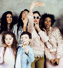 Image showing Lifestyle and people concept: young pretty diversity nations woman with different age children celebrating on birth day party together happy smiling, making selfie. African-american, asian and caucasi