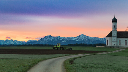 Image showing Alpine morning landscape with green agricultural fields