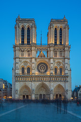 Image showing Notre Dame Cathedral with Paris cityscape at dusk