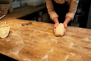 Image showing chef or baker cooking dough at bakery