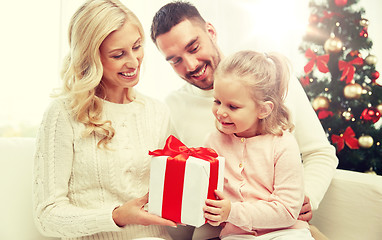 Image showing happy family at home with christmas gift box