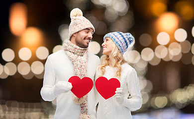 Image showing couple with red hearts over christmas lights