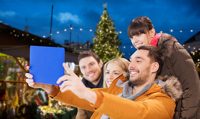 Image showing friends with tablet pc taking christmas selfie