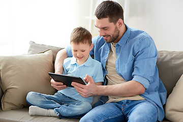 Image showing father and son with tablet pc playing at home