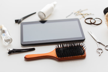 Image showing tablet pc, scissors, brushes and other hair tools