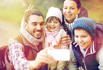 Image showing family taking selfie with smartphone in woods