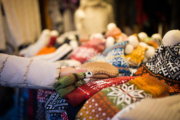 Image showing woman buying woolen mittens at christmas market