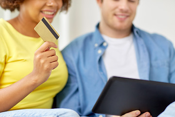 Image showing couple with tablet pc and credit card