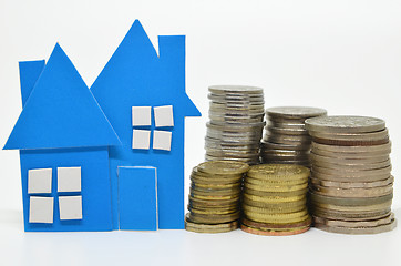 Image showing House model and stacks of coins