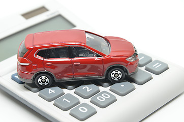 Image showing Calculator and red toy car