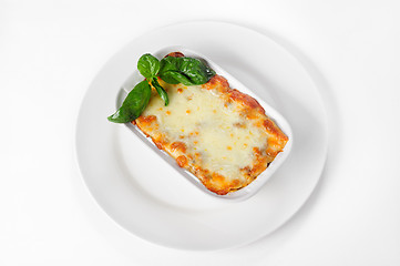 Image showing Fresh hot lasagna on white