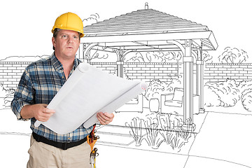 Image showing Male Contractor With House Plans Wearing Hard Hat In Front of Cu