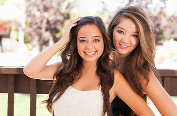 Image showing Two Mixed Race Girlfriends Pose for Portrait Outdoors