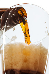 Image showing Glass of beer and bottle