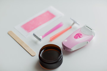Image showing hair removal wax, epilator and safety razor