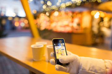 Image showing mulled wine picture on smartphone at christmas