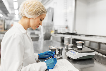 Image showing woman working at ice cream factory