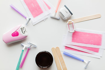 Image showing hair removal wax, epilator and safety razor