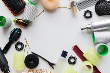 Image showing hair brushes, styling sprays, curlers and pins