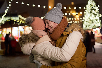 Image showing happy couple hugging at christmas tree