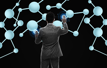 Image showing businessman working with molecule formula