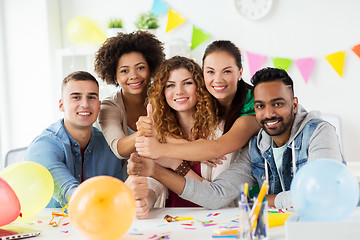 Image showing happy team at office party showing thumbs up