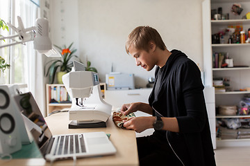 Image showing fashion designer with making dress at studio