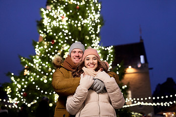 Image showing happy couple hugging at christmas tree