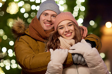 Image showing happy couple hugging at christmas tree