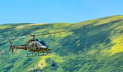 Image showing Helicopter in Mountains