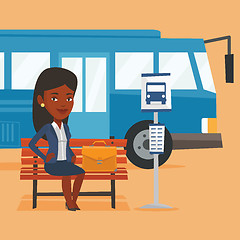 Image showing Business woman waiting at the bus stop.