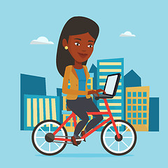 Image showing Woman riding bicycle in the city.