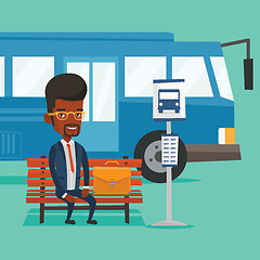 Image showing Business man waiting at the bus stop.