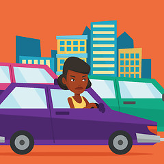 Image showing Angry african woman in car stuck in traffic jam.