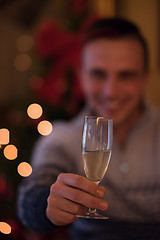 Image showing Happy young man with a glass of champagne