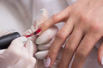 Image showing Woman hands receiving a manicure